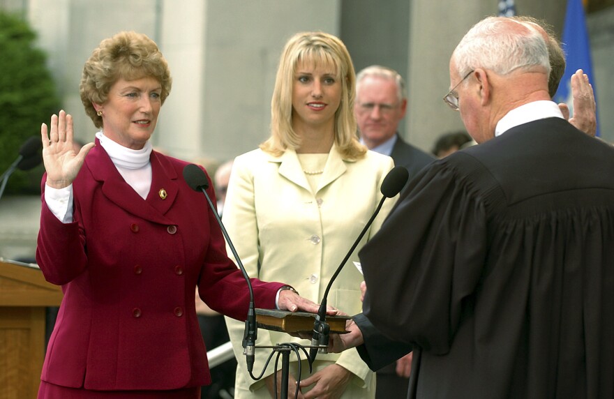M. Jodi Rell is sworn in as Governor of Connecticut by state Supreme Court Chief Justice William J. Sullivan as her daughter, Meredith O'Connor, center, looks on in a ceremony on the steps of the state Capitol in Hartford, Conn., July 1, 2004.