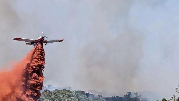 An airtanker helps put out the Spring Creek Fire near Parachute on Sunday, June 25, 2023.