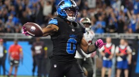 Detroit Lions running back Jammer Gibbs (0) celebrates his touchdown against the Tampa Bay Buccaneers during the second half of an NFL football game, Monday, Oct. 20, 2025, in Detroit. AP Photo/Ryan Sun)