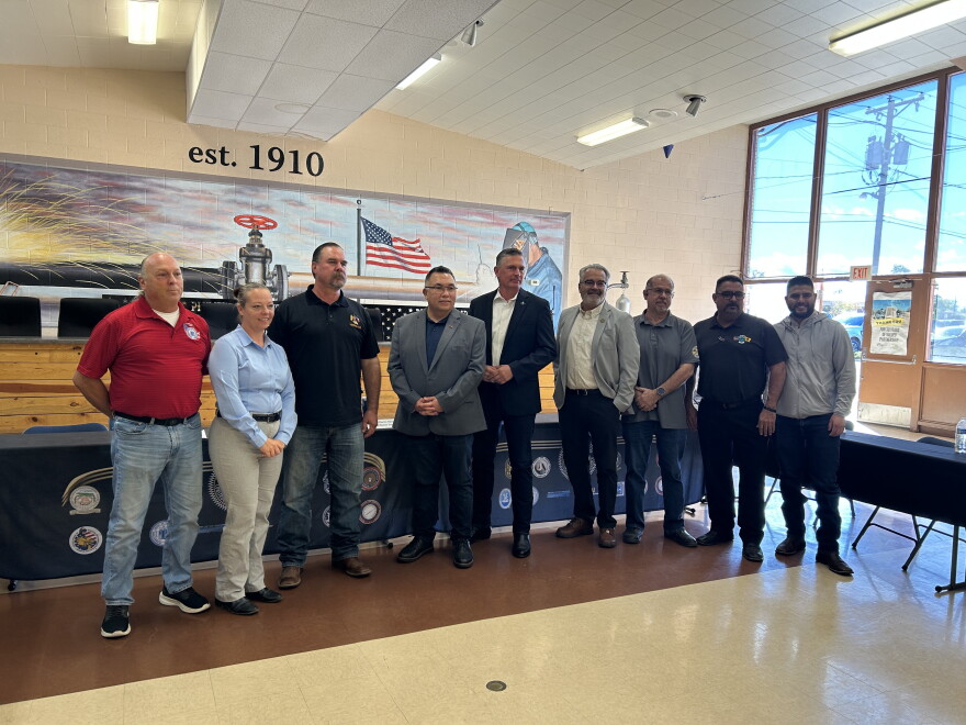U.S. Senator Martin Heinrich (D-NM) poses for a portrait with labor union leaders.