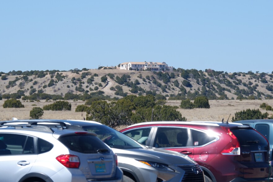 A view of Zorro Ranch from NM-41 as protesters' cars line the road
