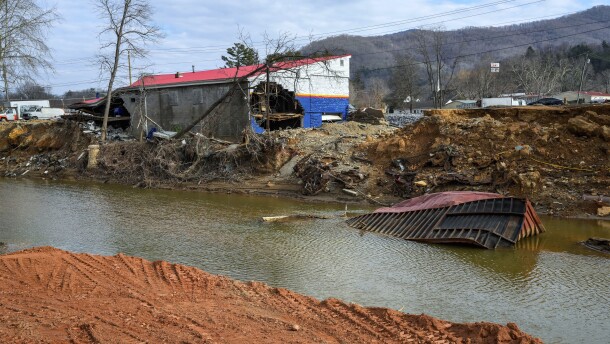 A view of the Swannanoa River and several buildings destroyed by Hurricane Helene as seen from the edge of Vickie Revis' property, Wednesday, Feb. 5, 2025, in Swannanoa, N.C. (AP Photo/Kathy Kmonicek)