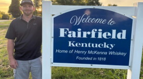 A recent photo of Herbie Hardin by the Fairfield, Kentucky sign.