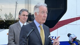U.S. Representative Richard Neal addresses a press conference as Springfield Mayor Domenic Sarno looks on.