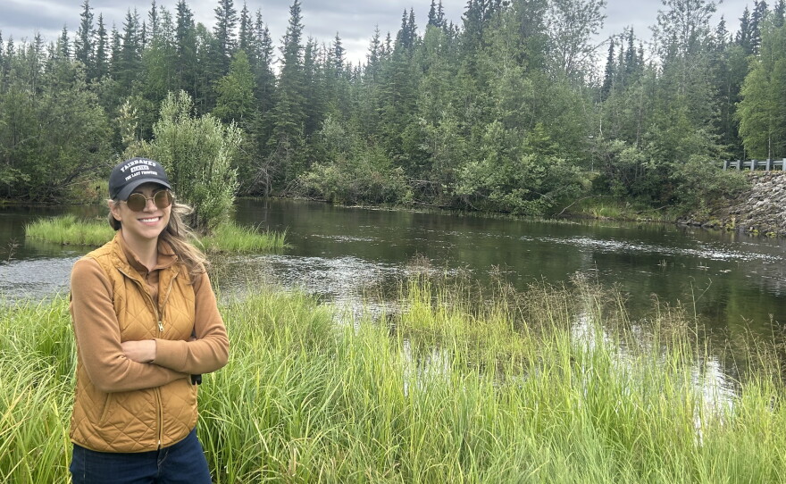 Sarah Hollister stands at one of her family's favorite spots at a military recreation area, which is now inside the footprint of a potential future data center near Eielson Air Force Base outside of Fairbanks, Alaska.