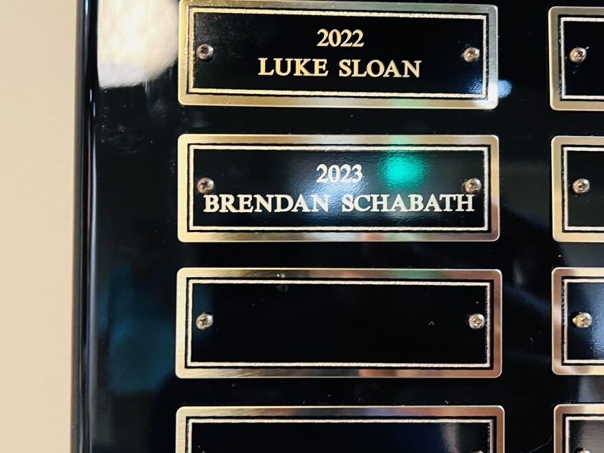 Brendan Schabath's name engraved on the official Earle Robinson Award plaque.