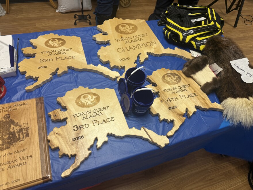 Alaska-shaped plaques, shown here, were given out to each Yukon Quest Alaska 750 finisher. (Patrick Gilchrist/KUAC)