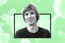 A head shot of Taylor Wilson against a green molecular background.