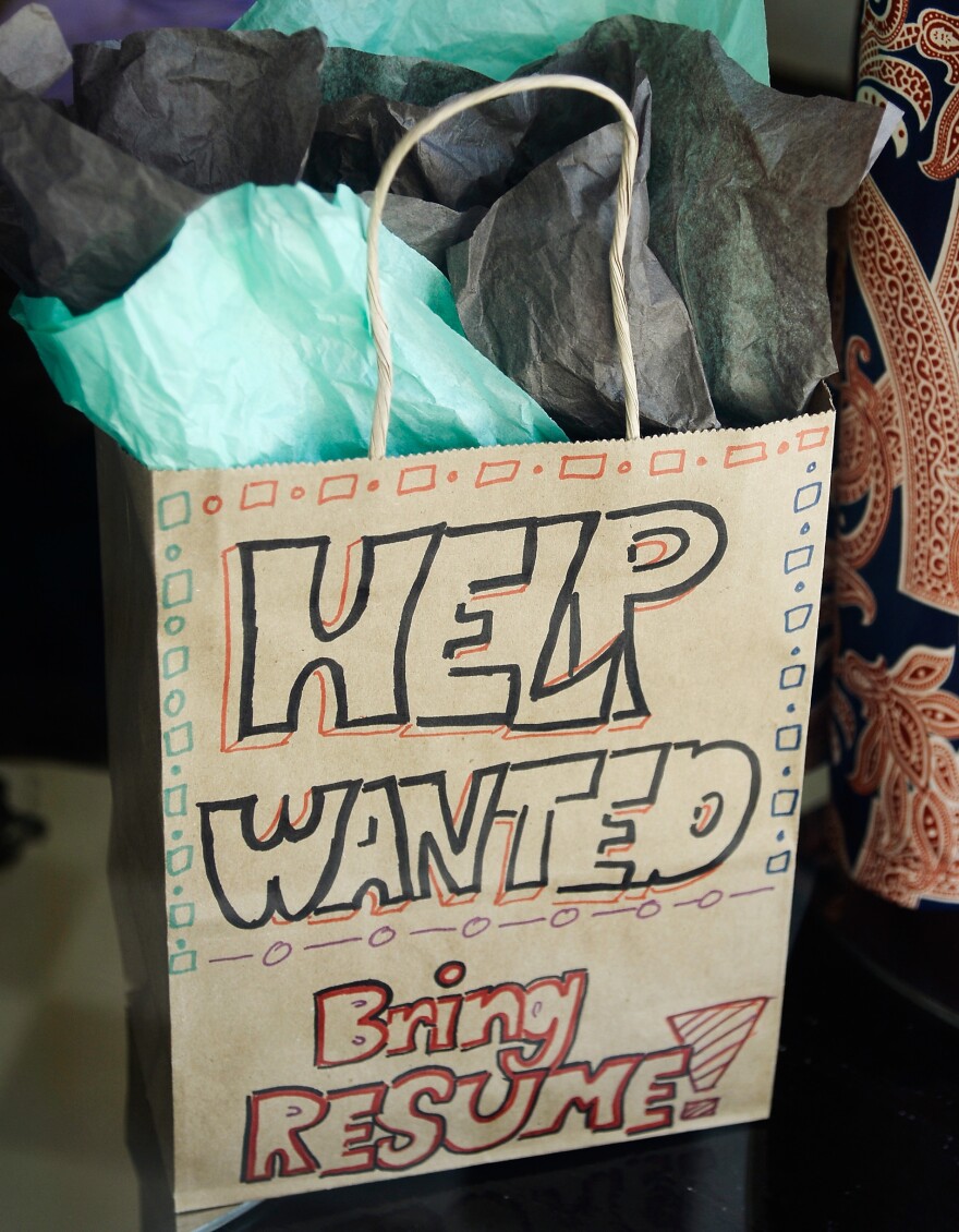 A help wanted sign in the window of a clothing store in Pasadena, Calif., last month.