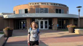 Nicole's daughter stands outside Park Hill High School. Her mom worried before she enrolled that students with disabilities took all their classes in the basement, and lobbied the school district to move classrooms upstairs.