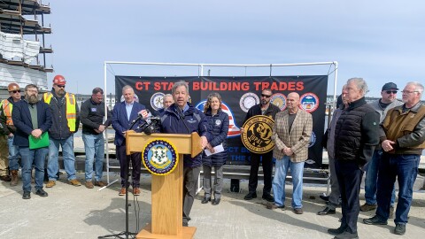 Michael O'Connor, executive director of Connecticut Port Authority at the podium during a press conference about Revolution Wind in New London on March 26, 2025. The pier will continue to assemble turbines for Sunrise Wind, another offshore wind project in New York, through the end of 2027 and will continue to be available for other wind projects should they be approved according to O’Connor.