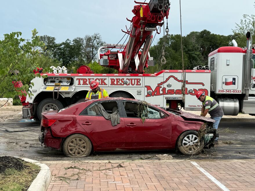 A car pulled from the floodwaters near Perrin Beitel on Thursday, June 12, 2025.