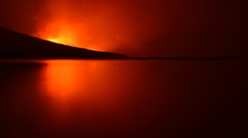 The Howe Ridge Fire in Glacier National Park as seen from Apgar Beach, August 12, 2018.