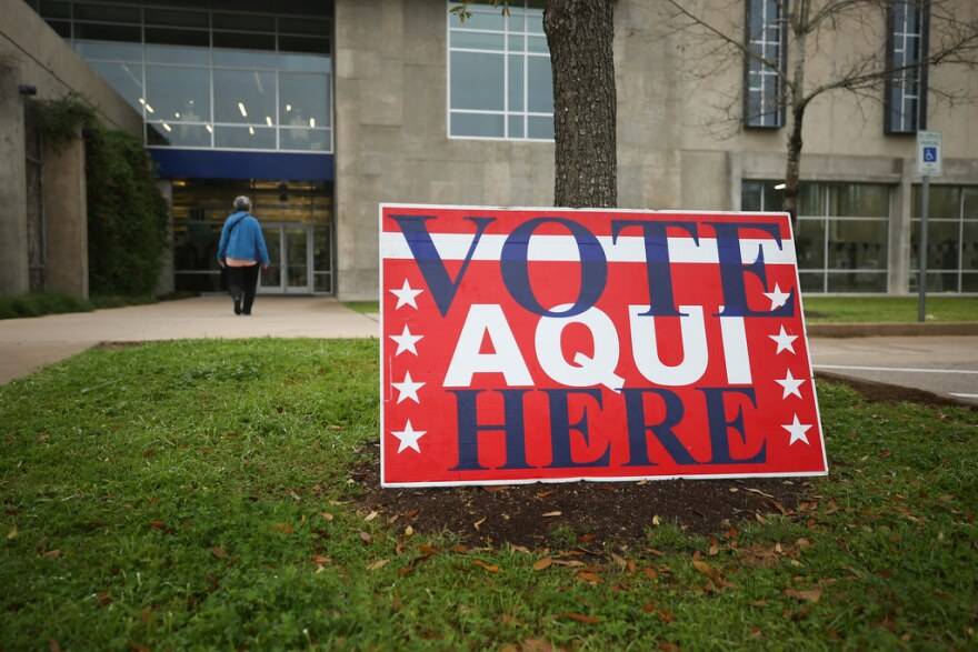 A voter enters a polling place at the North Austin YMCA on March 3, 2020.