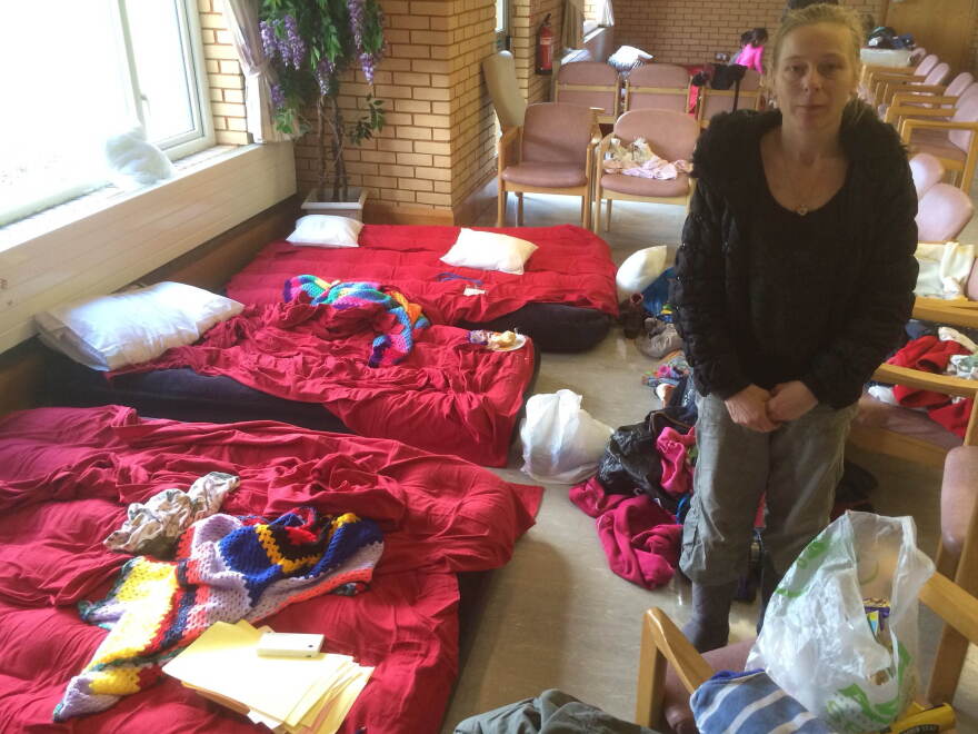 Priscilla Smithers and her four children have arranged chairs around a few air mattresses to create a space for themselves, after fleeing their home.
