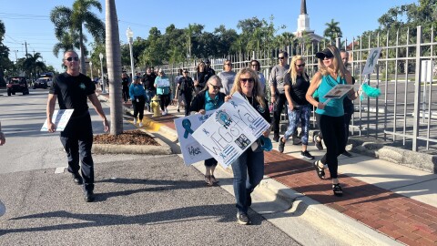 The City of Fort Myers marked PTSD Awareness Day with a walk downtown.