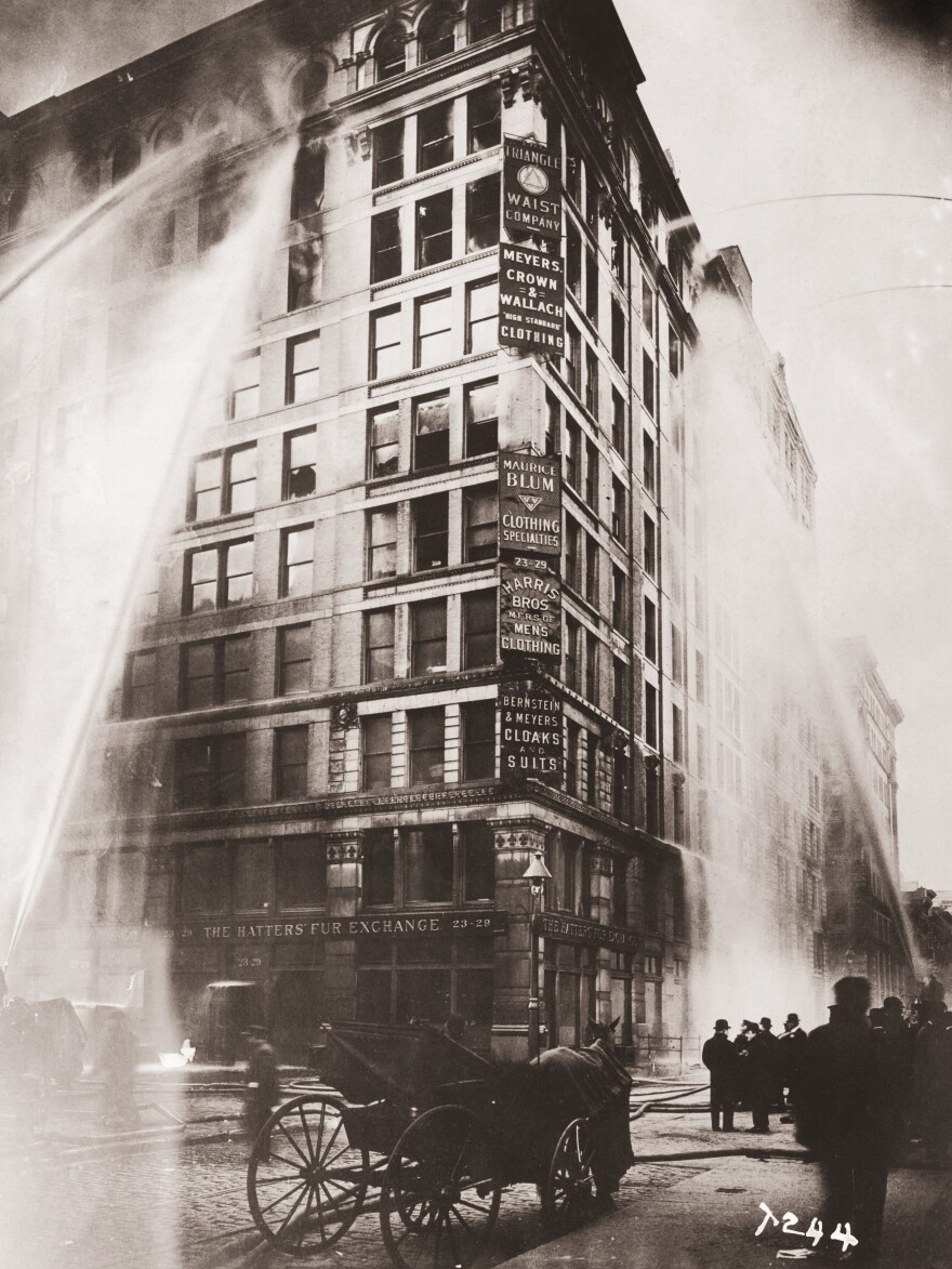 Firemen in New York's Greenwich Village spray water on the upper floors of the Asch Building, housing the Triangle Shirtwaist Company, on March 25, 1911. That day, 146 factory workers died.