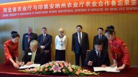 Indiana Department of Agriculture director Ted McKinney (left, seated) signs a friendship agreement with China's Hebei Provincial Department of Agriculture during a trade mission in 2015.
