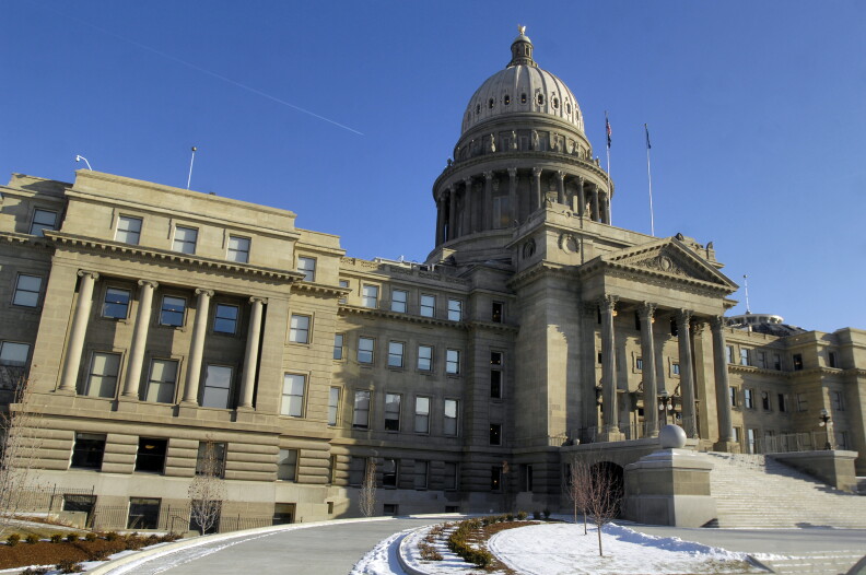 A photo of the Idaho Statehouse with snow on the ground.