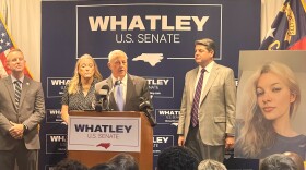 Man speaks at podium
