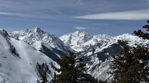 From left, Pyramid Peak and the Maroon Bells are seen from Aspen Highland Ski Resort. The three fourteeners are in the Maroon Bells-Snowmass Wilderness, overseen by the U.S. Forest Service, which uses the NEPA process to govern certain projects.