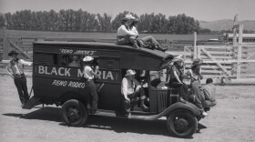 Women ride in mock paddy wagon.