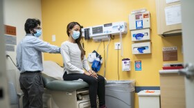 Dr. Matthew Kusher checks a patient.