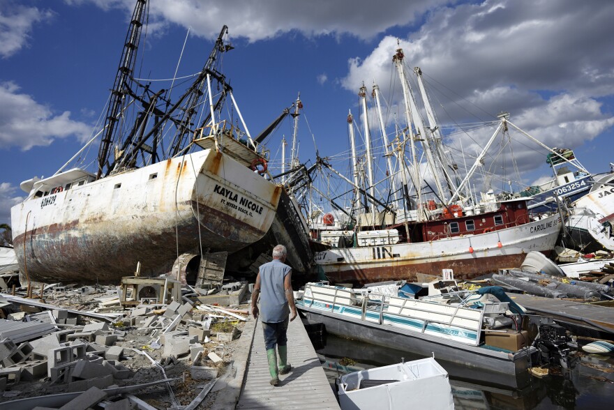 "Wrecked shrimp boats and other vessels littered the waterfront on San Carlos Island, Fort Myers Beach, FL, one week after Hurricane Irma made landfall.