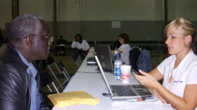 Jerome Scott meets with a NACA representative about adjusting his mortgage.