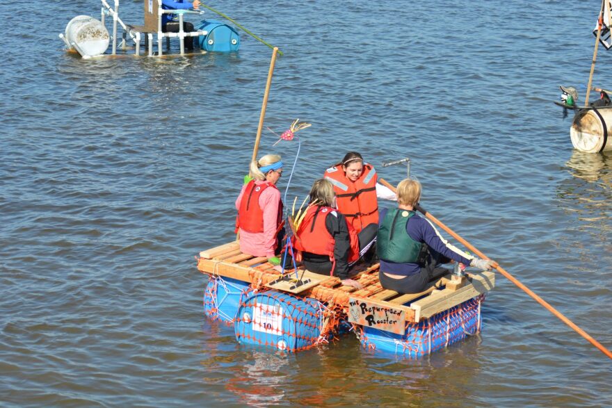 Members of the Repurposed Rooster set sail for the finish line. The group finished last and won the award Bringing Up the Rear at Saturday's Workout on the Waterfront Repurpose-It Regatta.