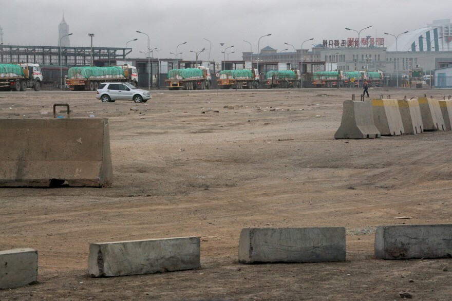 Approximately 1,100 vehicles cross the Mongolia-China border daily. These trucks carry copper concentrate from Oyu Tolgoi, packed in white bags and covered with a green tarp.