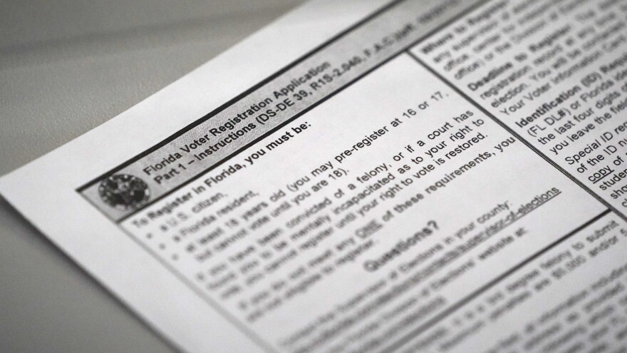  A Florida voter registration application is shown at the Miami-Dade County Elections Department.