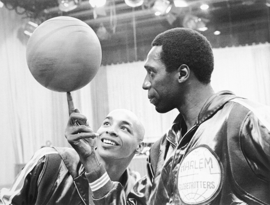 Neal (left), shown here with fellow Globetrotter Meadowlark Lemon, has died at age 77.