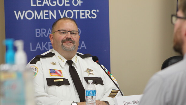 Sheriff Bryan Welk participates in a sheriff's candidate forum Sept. 8, 2026, at Sylvan Town Hall in southern Cass County. In the foreground is Cass County Attorney Ben Lindstrom.