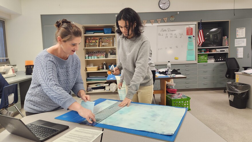Pocono Mountain West teacher Joanne Kutra works with a student in class this week.