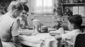 Mr. and Mrs. Paul, and their children Belinda and Cliff, say grace before starting their meal.  (Jacobsen /Three Lions/Getty Images)