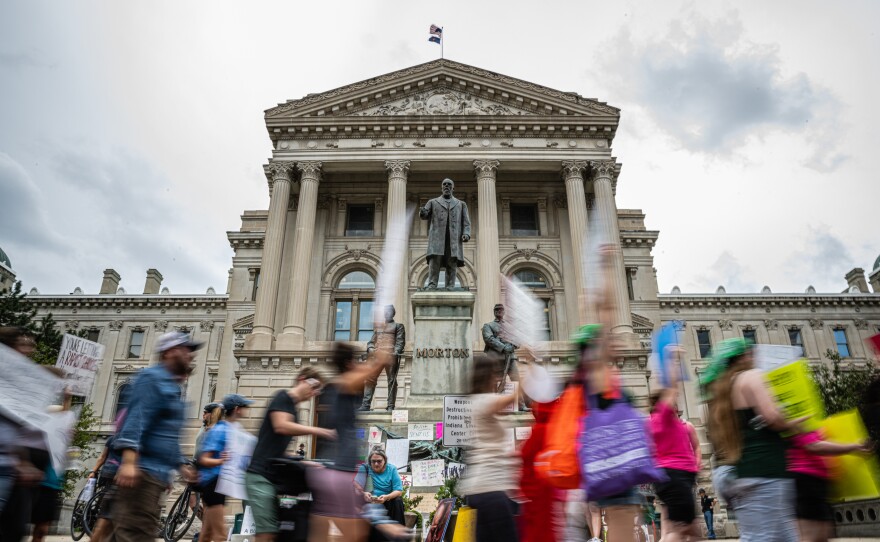 Abortion rights protesters march outside the Indiana State Capitol building in Indianapolis, Indiana. State legislature races have become more high-stakes in setting policy around issues like reproductive rights in 2022. (Photo by Jon Cherry/Getty Images)