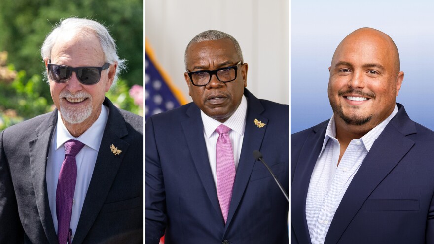 Attorney General Gordon Rhea, Governor Albert Bryan Jr., and Brett “Mac” McClafferty are pictured left to right.