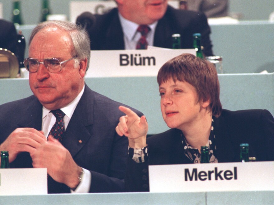 In an undated photo from the early 1990s, Merkel, then Germany's minister for women and youth, is shown beside Chancellor Helmut Kohl. Unlike Kohl, Merkel did not live through World War II and was not shaped by history in the same way as her predecessor.