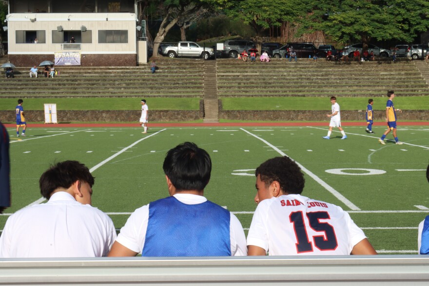 Saint Louis soccer players sit on the bench during a game with Punahou on Jan. 8, 2026.