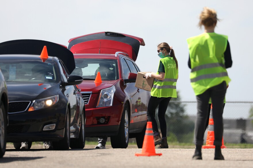 The Central Texas Food Bank distributes boxes of food to families during the COVID-19 pandemic.