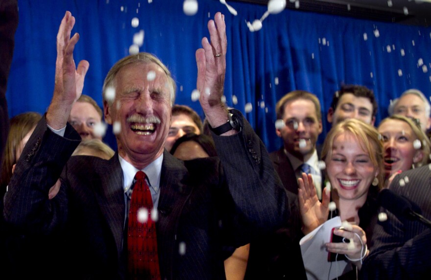 Independent Angus King celebrates under a splash of champagne in Freeport, Maine, on Tuesday, after winning the Senate seat vacated by Republican Olympia Snowe.