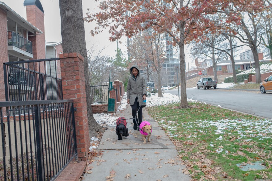 Jaleesa Garlandwalks her dogs around her new Tulsa neighborhood.