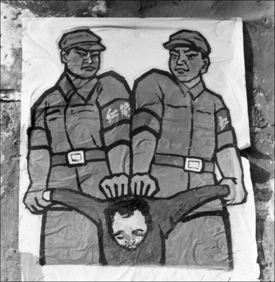A propaganda poster from Beijing in late 1966 features Red Guards and an "enemy of the people."