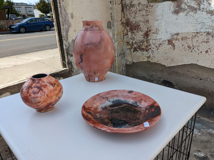  Morgan's pottery features a firing technique know as Saggar firing, where various litter such as wood chips, corn husks and steel wool is wrapped up with the pottery in tin foil before going in the kiln, creating the burned patterns.
