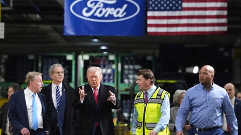 President Donald Trump speaks to, from left Bill Ford, Executive Chairman of Ford, Treasury Secretary Scott Bessent, Jim Farley, CEO of Ford, and Corey Williams, Ford River Rouge Plant Manager, during a tour of the Ford River Rogue complex, Tuesday, Jan. 13, 2026, in Dearborn, Mich.
