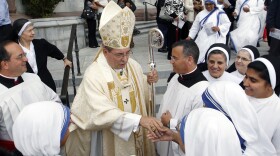 Archbishop John J. Myers stands outside Cathedral Basilica of the Sacred Heart in Newark, N.J. The archbishop has urged followers to assess the presidential candidates for their views on abortion and gay marriage.