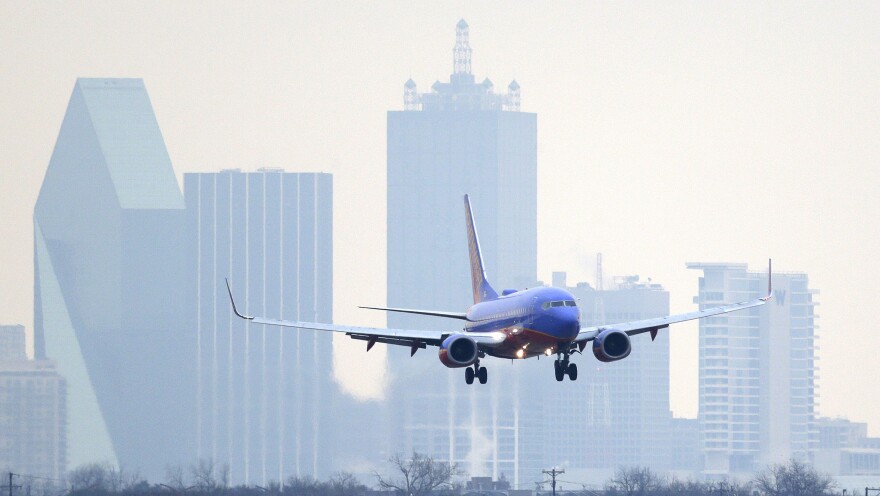 A Southwest Airlines jet plane lines up for a landing at Love Field in Dallas.