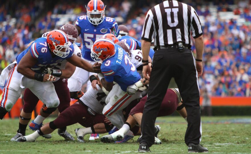 Harris goes down hard after being swarmed by the Eastern Kentucky defense.