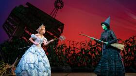 Glinda the Good Witch faces off with Elphaba, the Wicked Witch of the West.